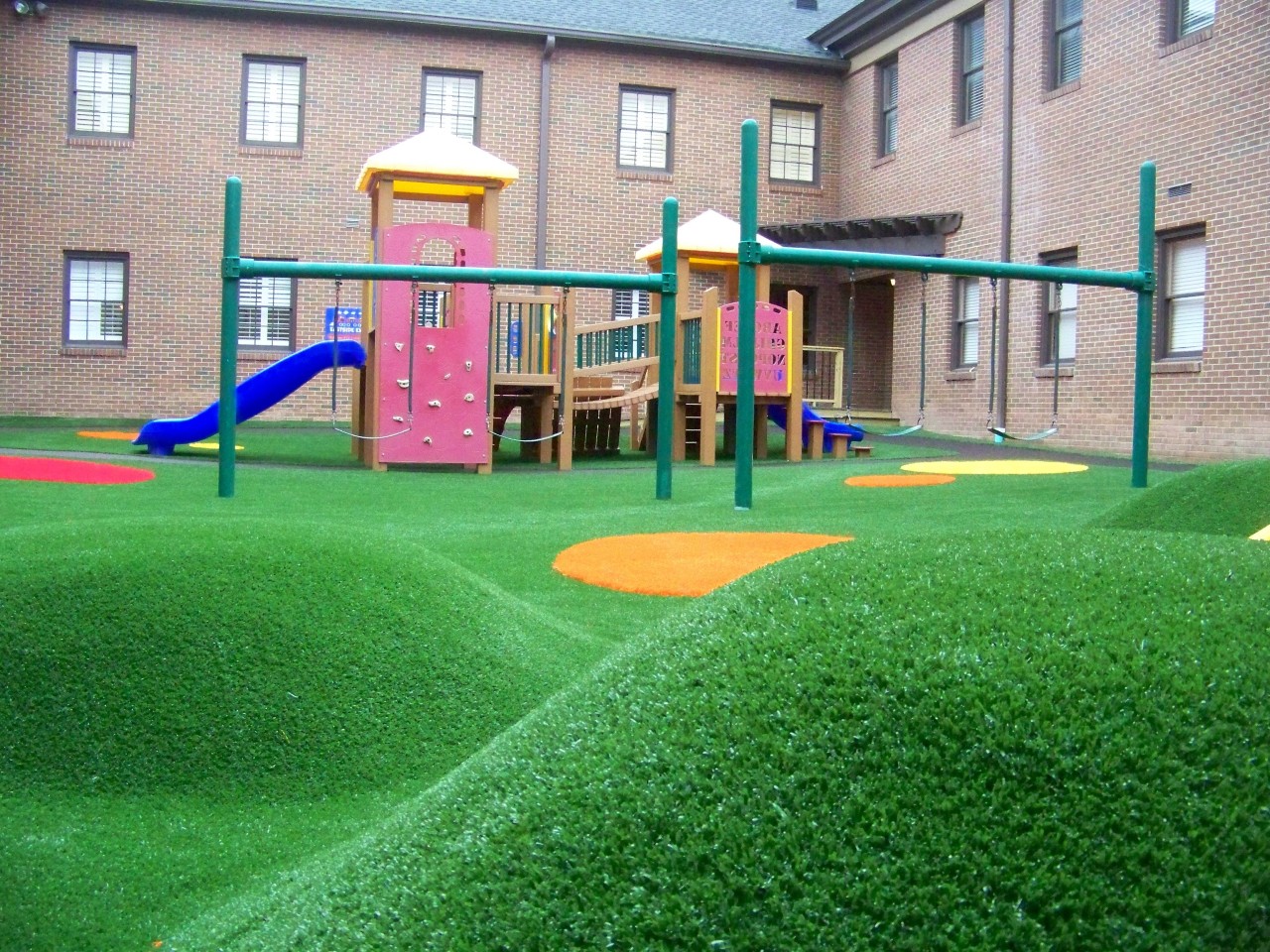 Hilly artificial turf playground by Southwest Greens of Huntsville